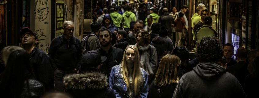 woman standing in crowd